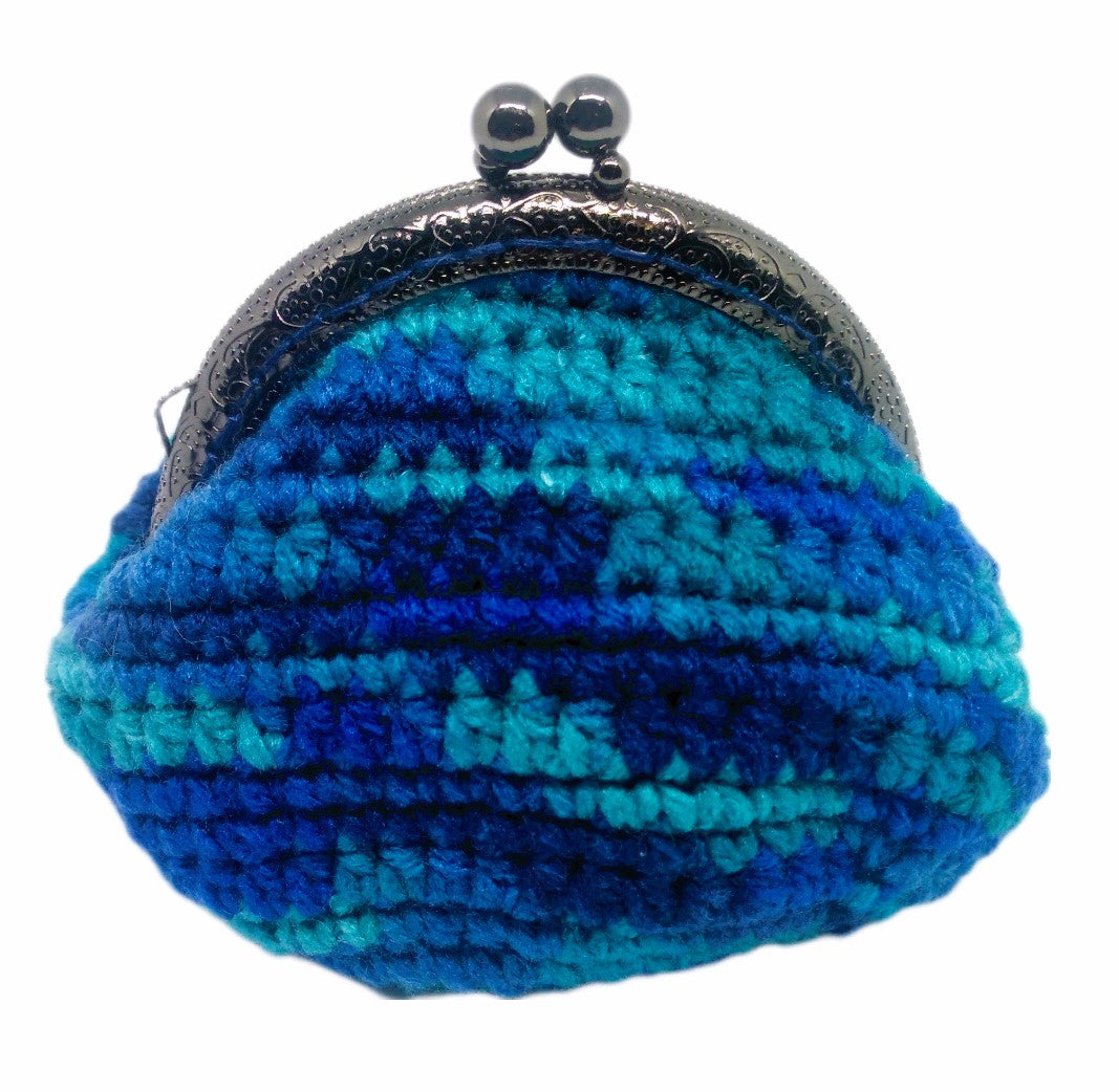 Front view. Variegated blue crochet coin purse with pewter kiss clasp frame. 