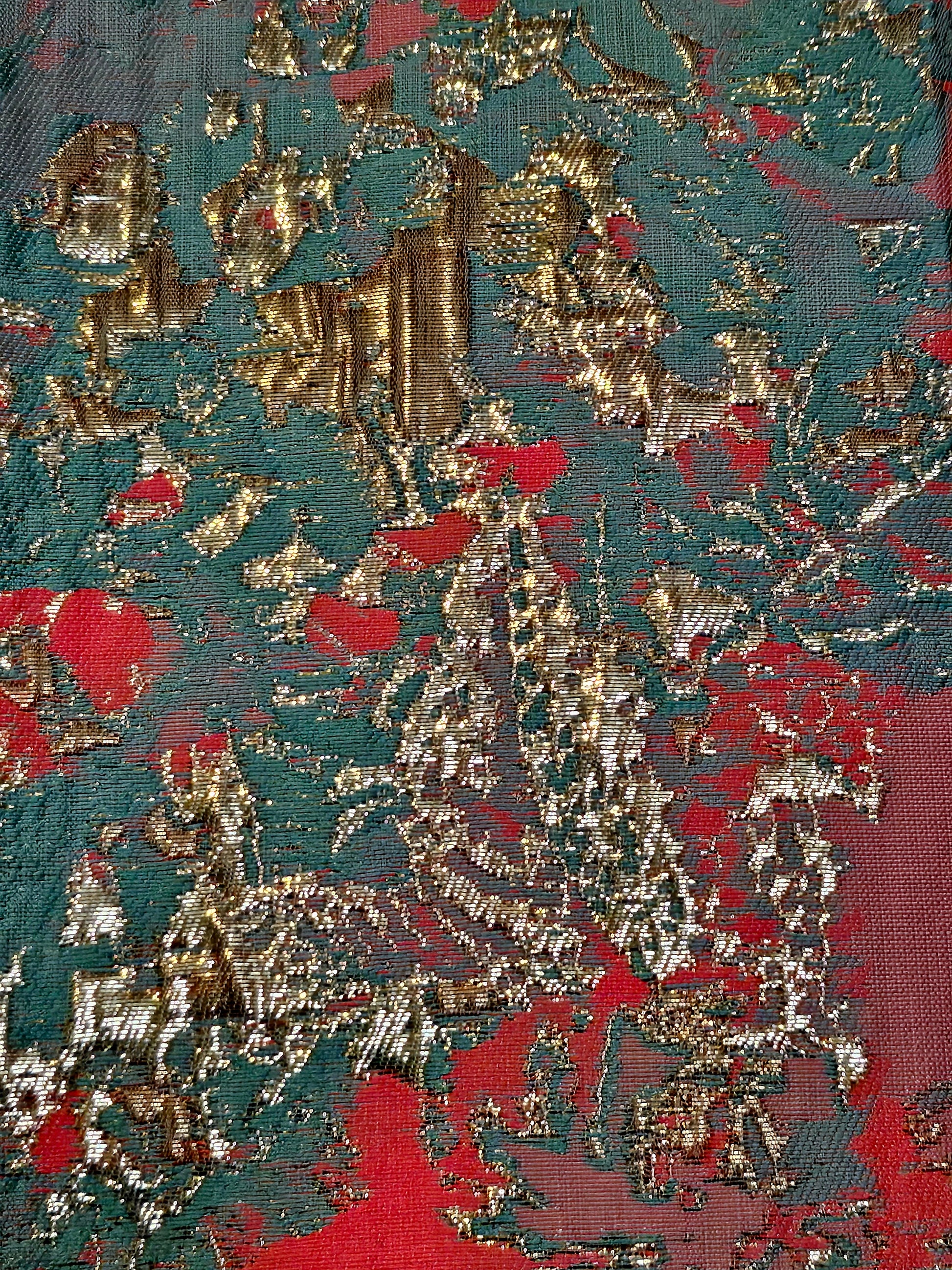 Fabric view of Coral and mint jacket with fringe cuffed sleeves