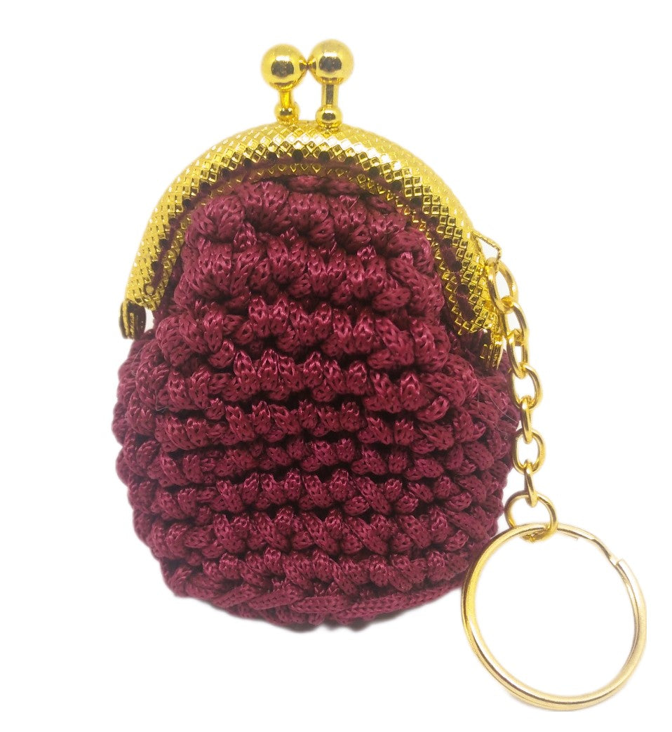 Front view of burgundy crochet coin purse keychain with gold kiss clasp frame.
