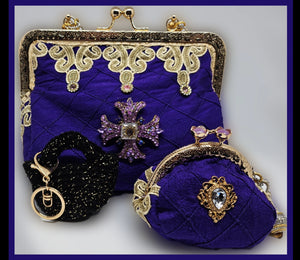 Matching handbag, coin purse, and keychain for Front view of Rhinestone encrusted purple silk bomber jacket with gold lace accents