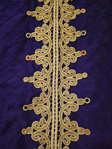 close up view of back details of Rhinestone encrusted purple silk bomber jacket with gold lace accents