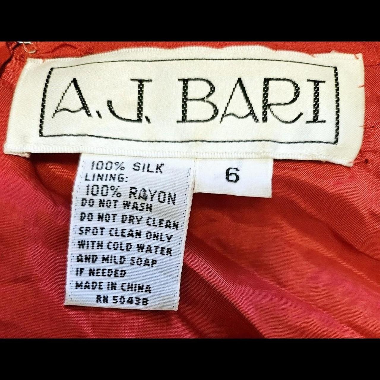 Label of red and Black Sequin Gown