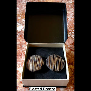 Pleated bronze button earrings in jewelry box