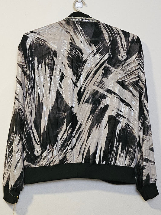 Back view of Sheer abstract printed bomber jacket with bowtie detail