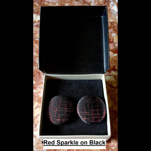 Red sparkle on black check print button earrings in jewelry box 