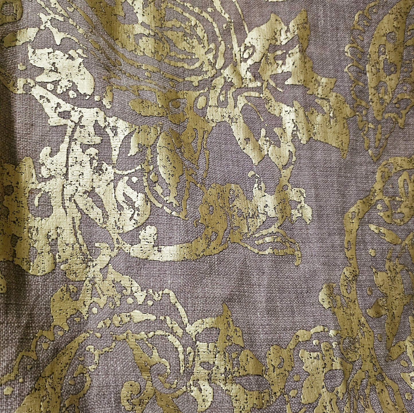 Fabric view of Lilac linen blend embossed with a golden baroque pattern