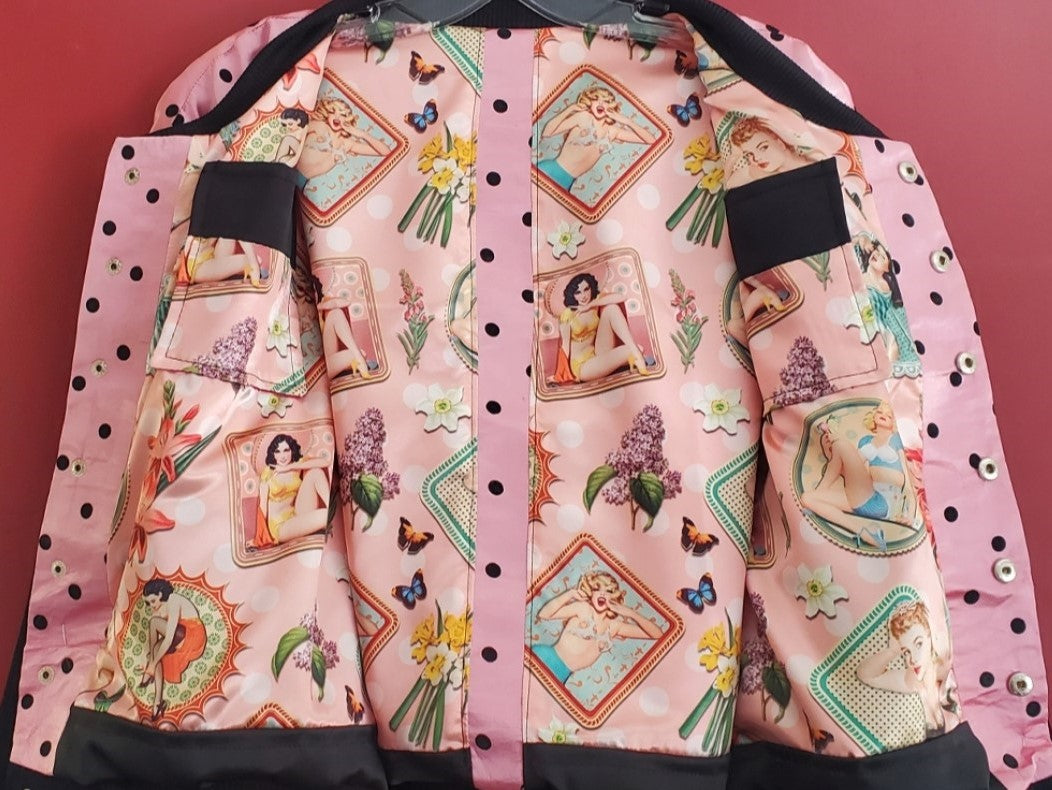 view of pinup lining of pink polka dot varsity jacket