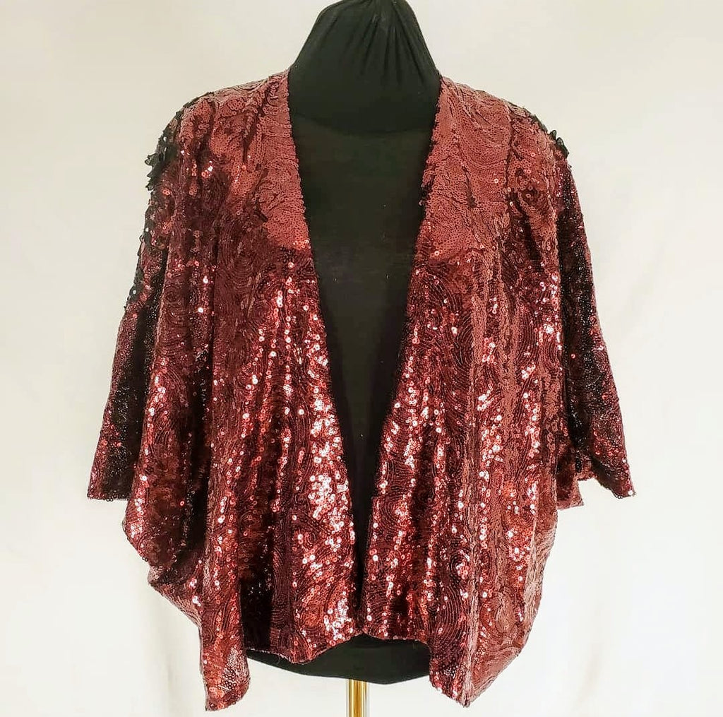 front view of Burgundy sequin kimono jacket with black embroidered shoulders on mannequin
