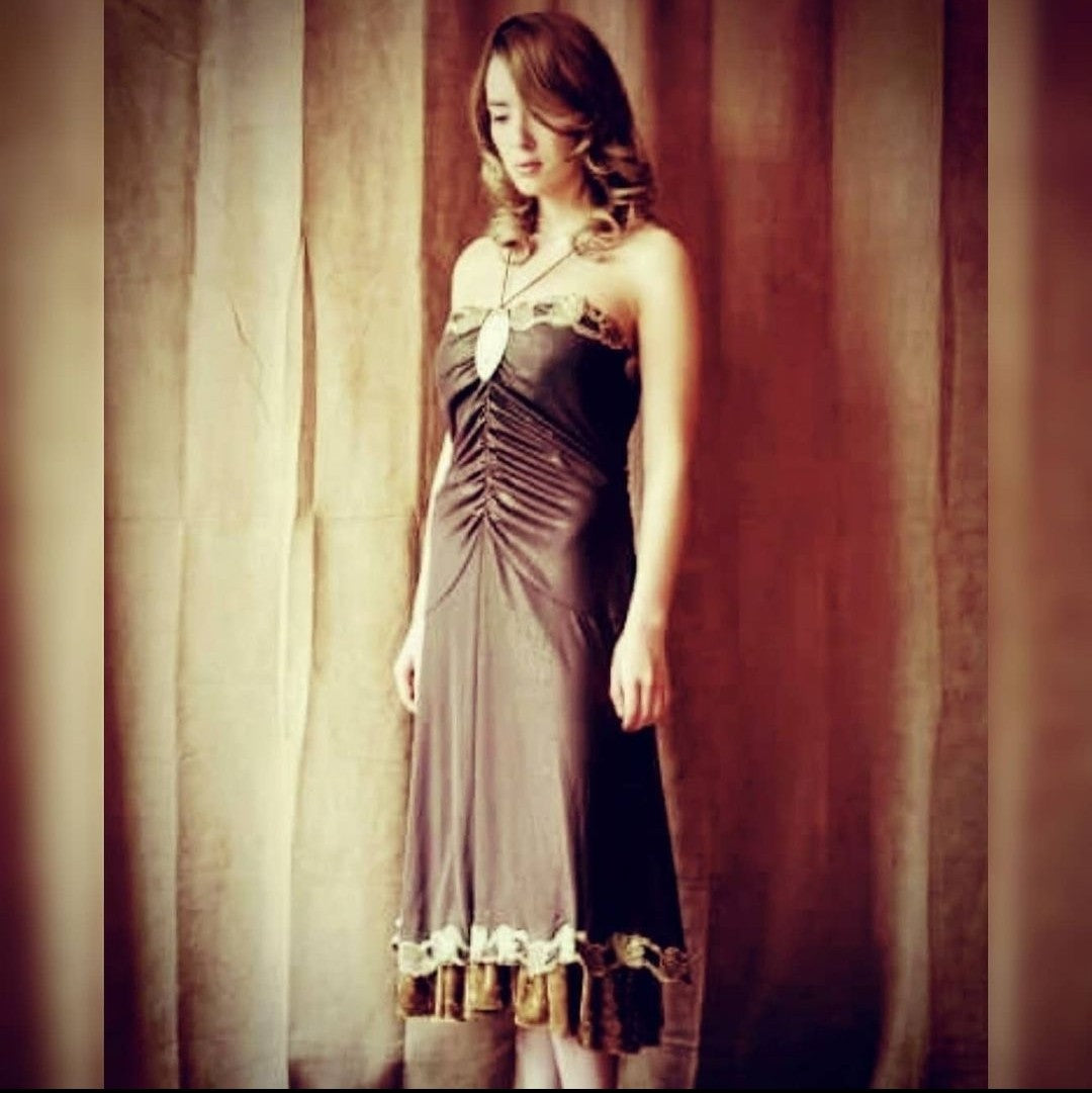 Upcycled ruched dress with golden lace and crushed velvet details on model