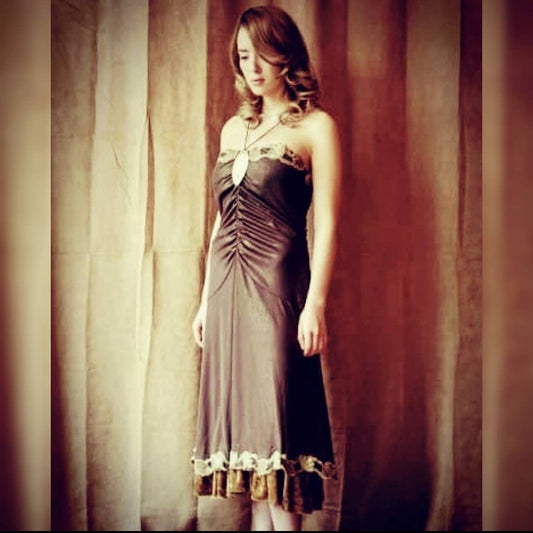 Upcycled ruched dress with golden lace and crushed velvet details on model