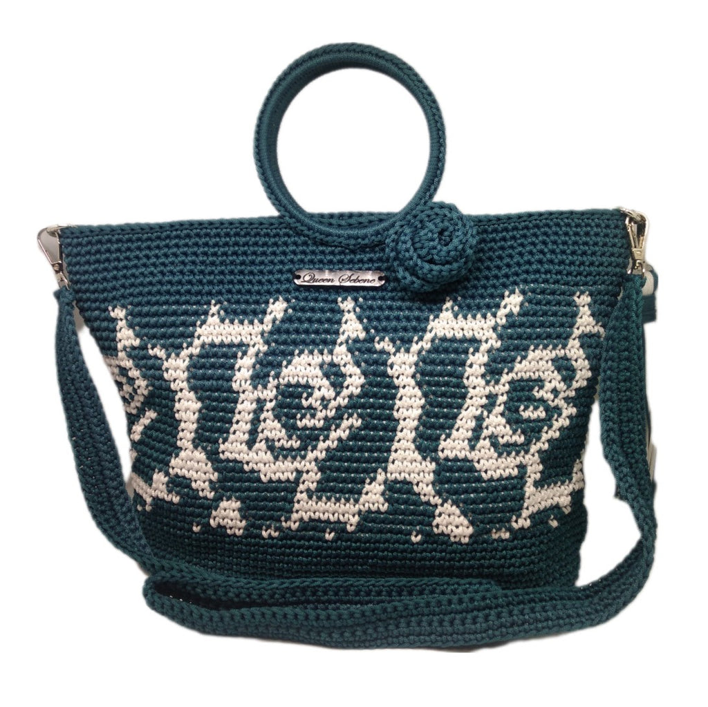 Front view of Teal handbag with white rose abstract print and 3D floral detail