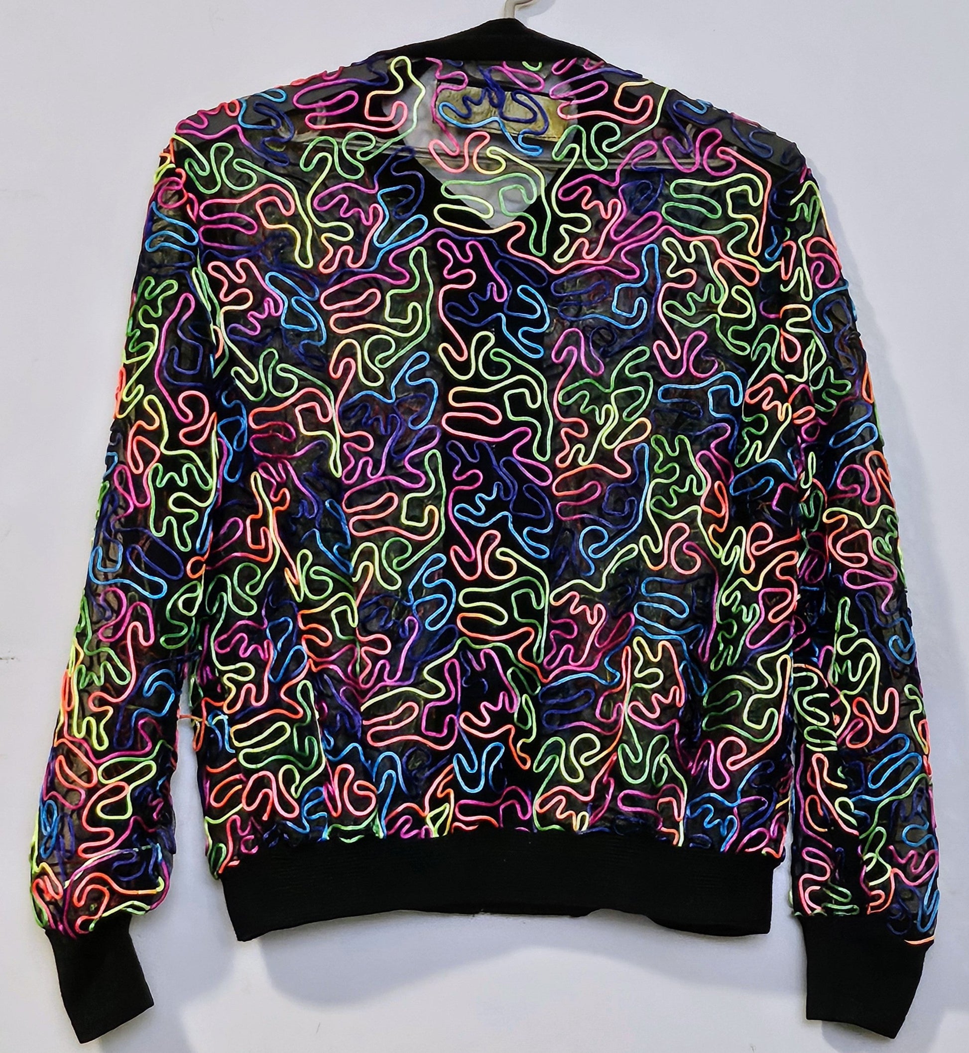 back view of rainbow embroidered mesh bomber jacket