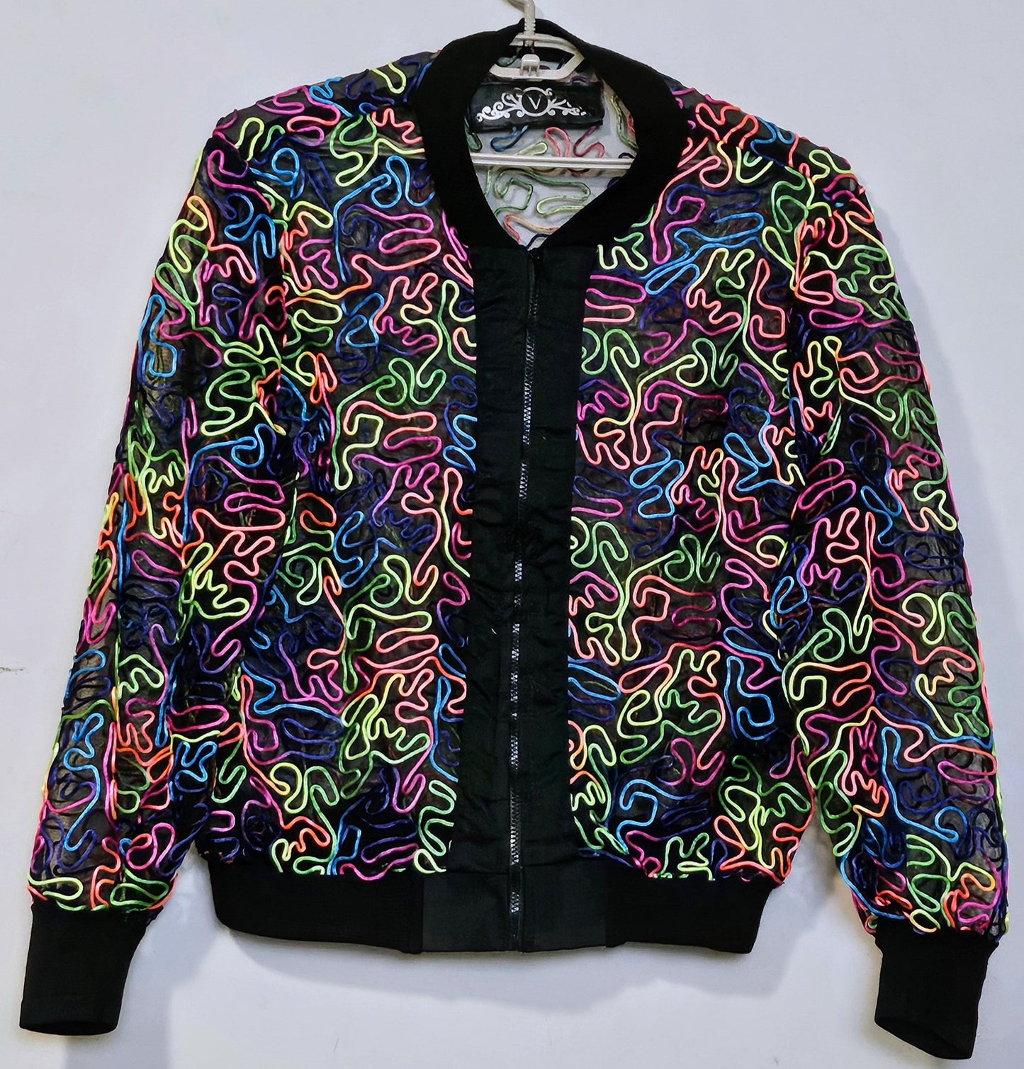 Front view of Rainbow embroidered mesh bomber jacket