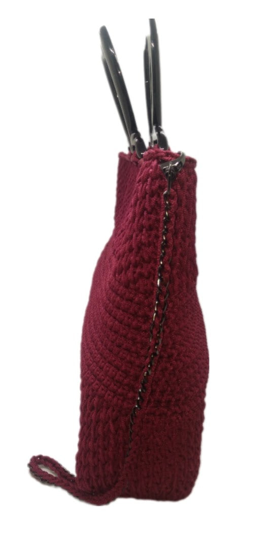 Side view Burgundy crochet handbag with black heart shaped acrylic handle