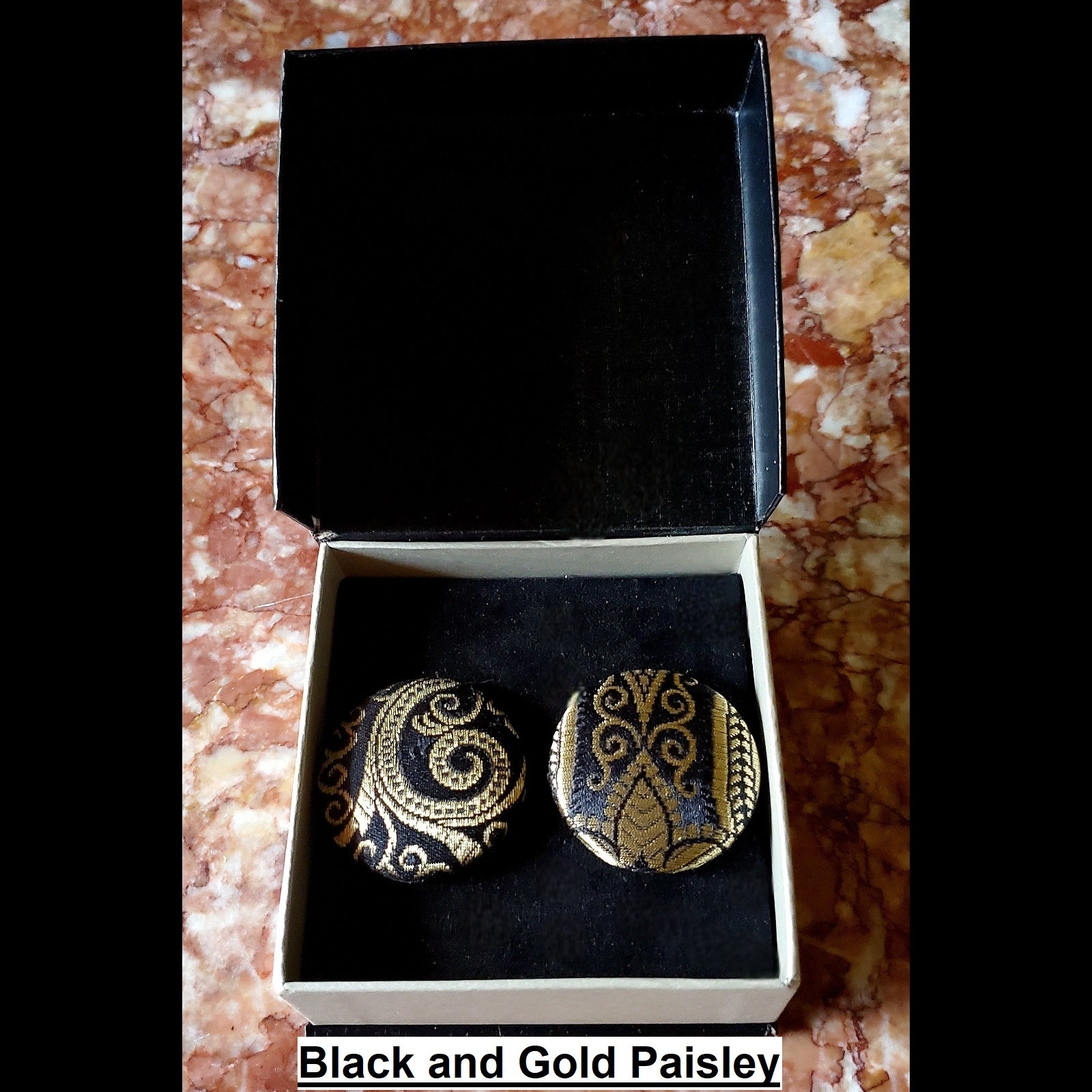 Black and gold paisley print button earrings in jewelry box