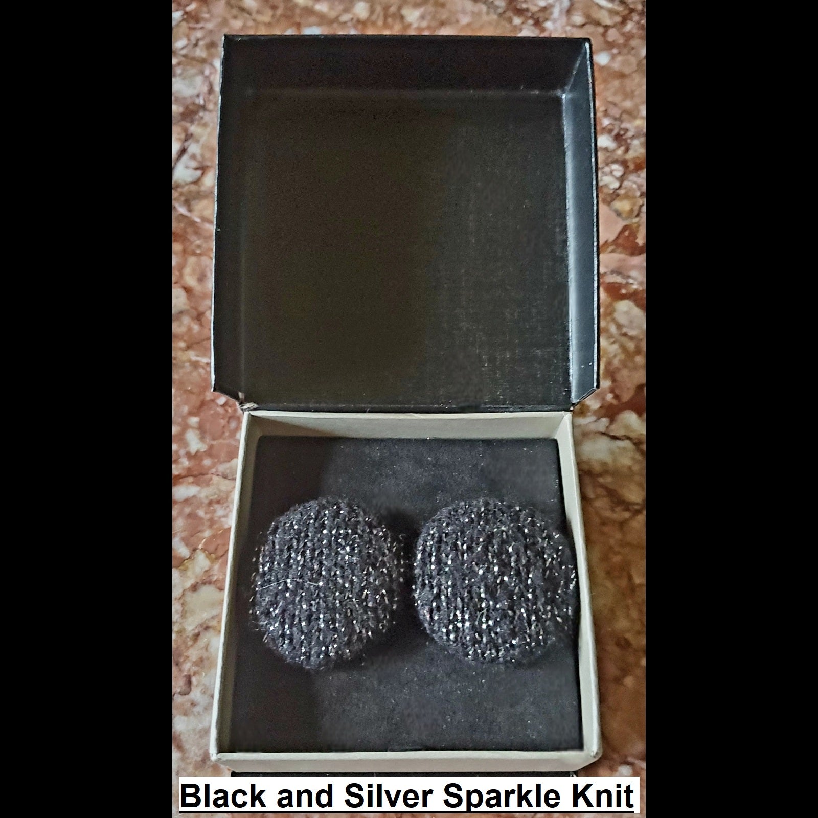 black and silver sparkle knit button earrings in jewelry box