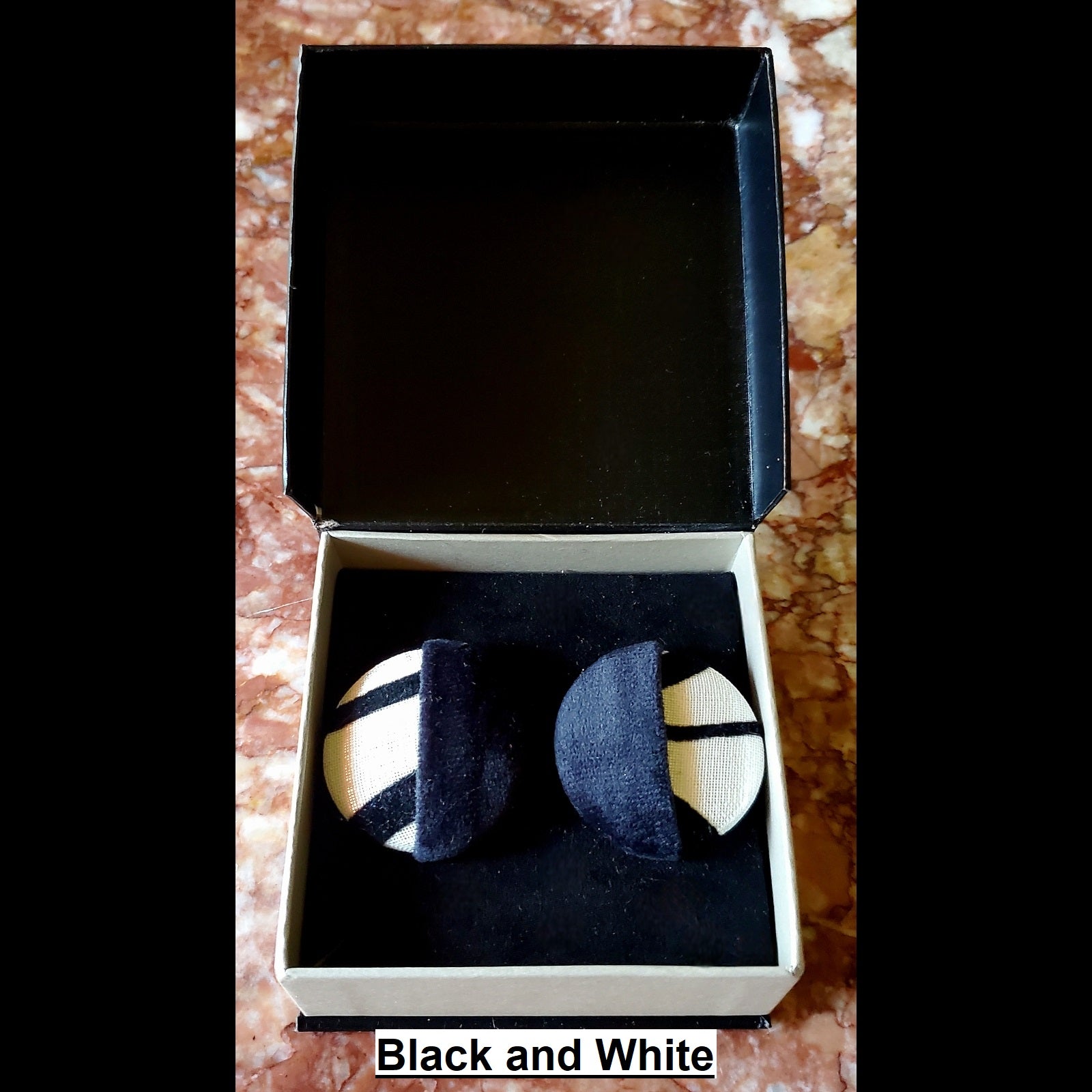 color blocked black velvet and zebra print button earrings in jewelry box