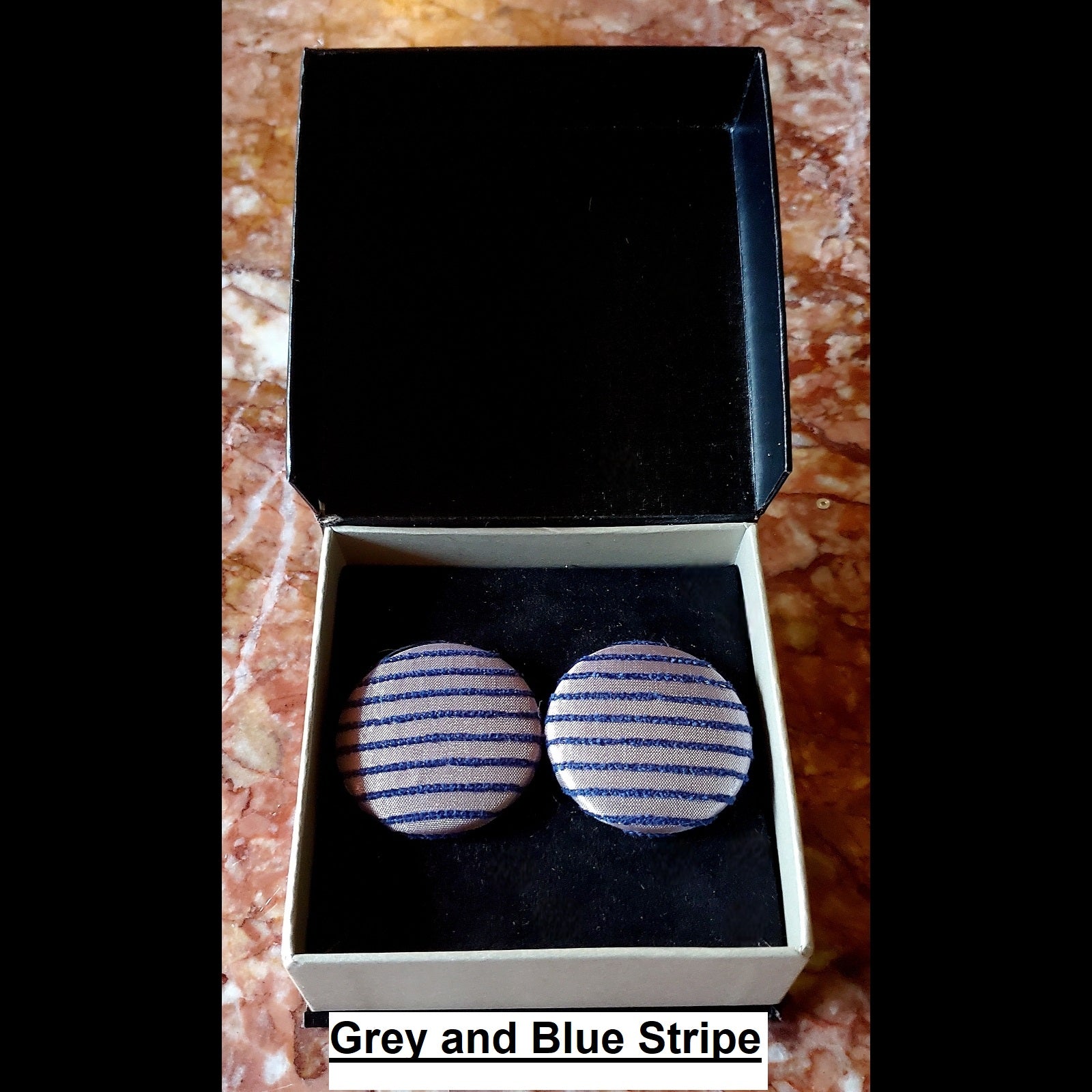 Grey and blue stripeprint button earrings in jewelry box 