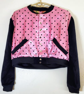 front view of pink polka dot varsity jacket