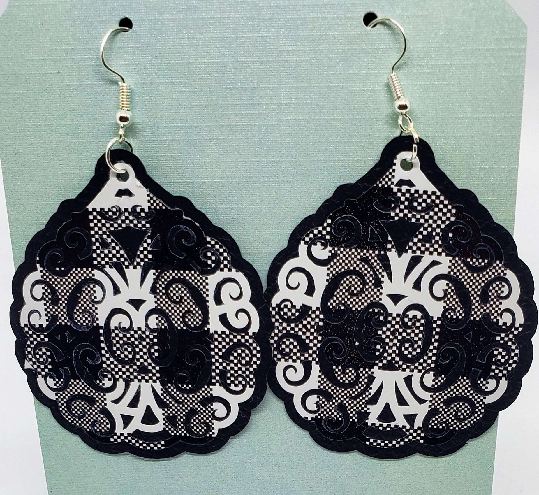 Black and white plaid on black filigree printed vinyl earrings.