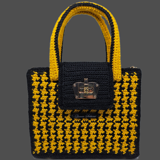Front view of Black and yellow houndstooth structured crocheted handbag