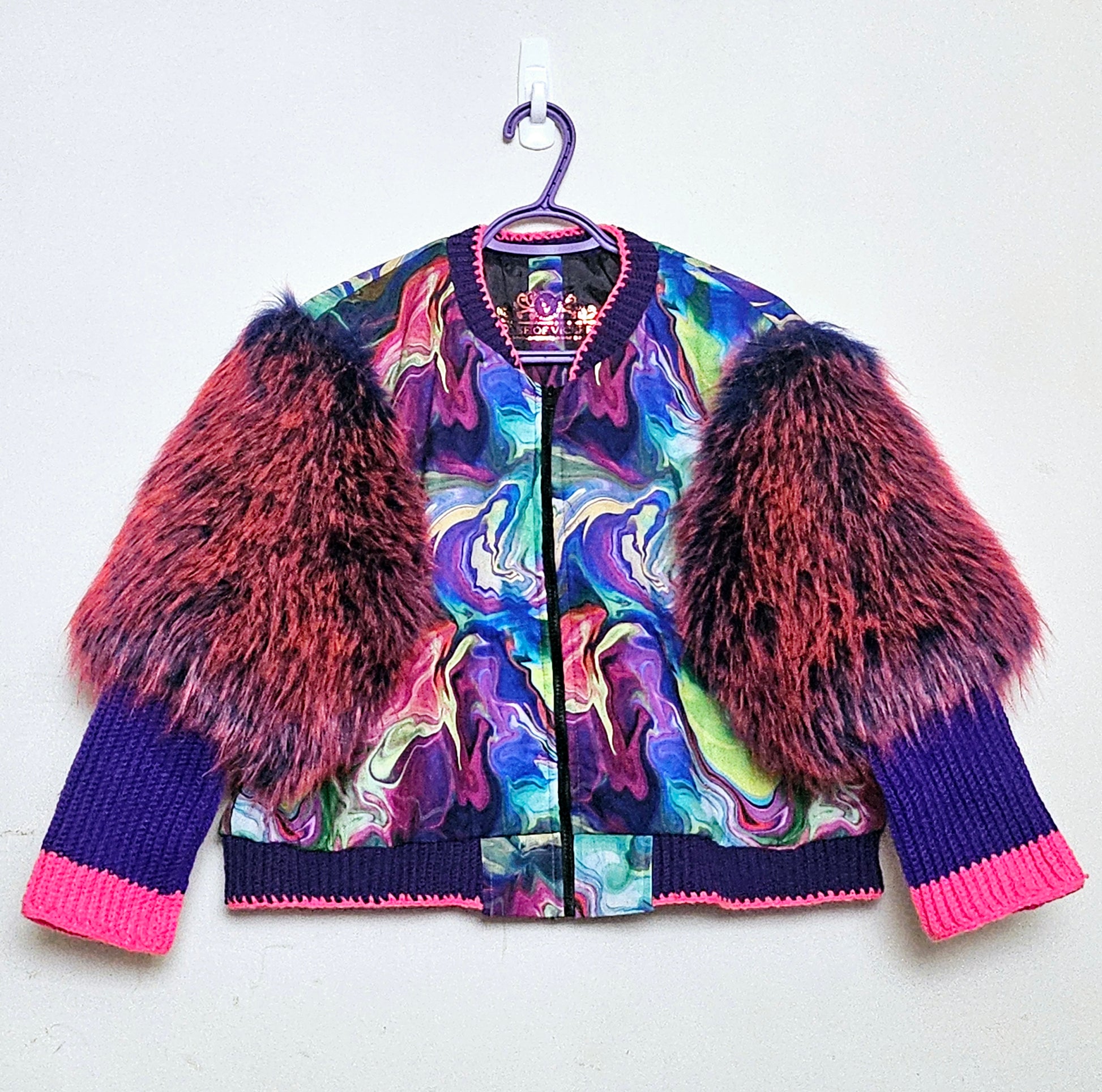Front view of Rainbow bomber jacket with faux fur puffed sleeves