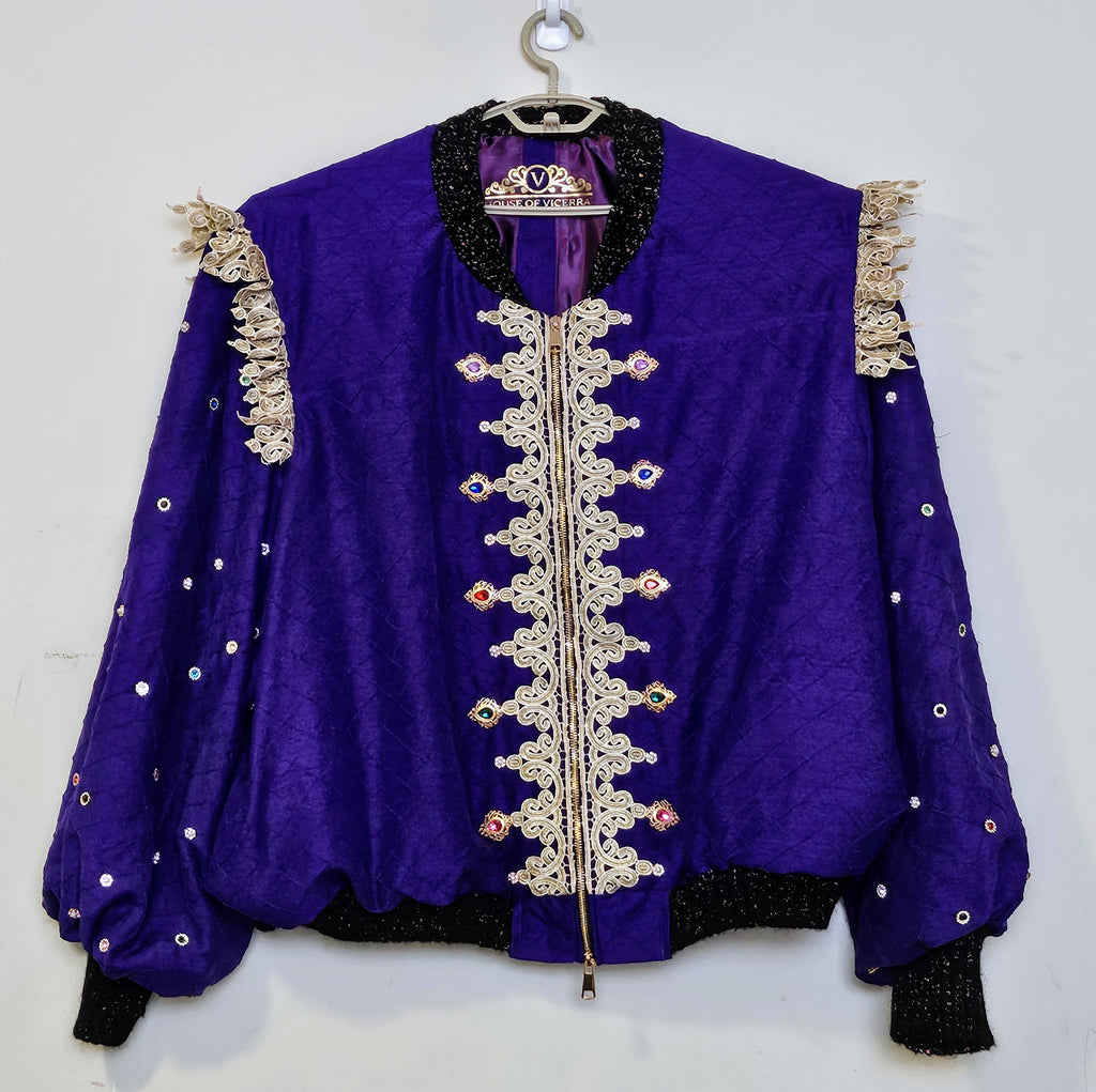 Front view of Rhinestone encrusted purple silk bomber jacket with gold lace accents
