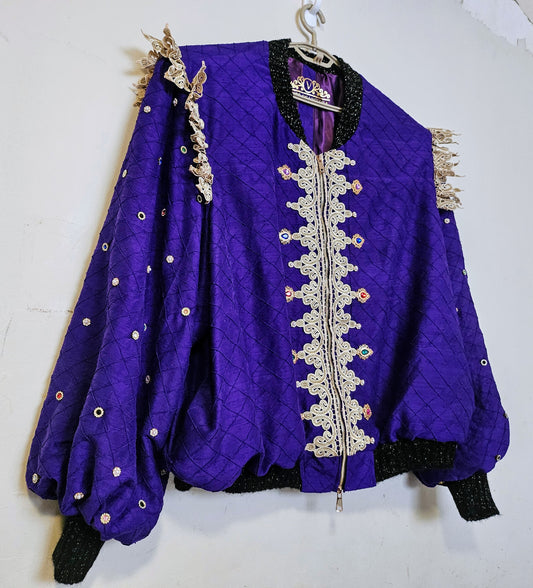 Side front view of Rhinestone encrusted purple silk bomber jacket with gold lace accents