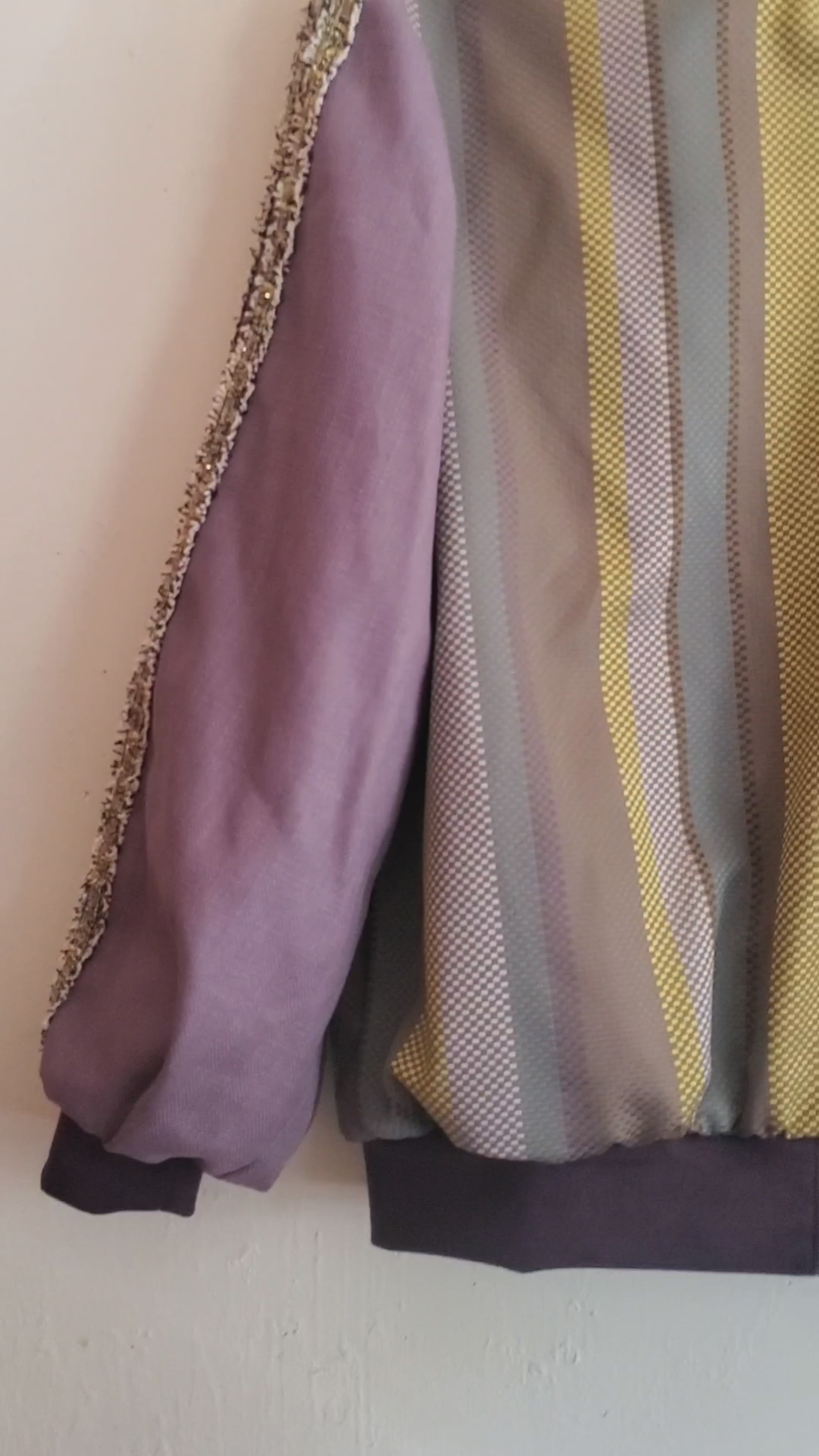 Video of Purple striped jacquard bomber jacket with racing striped sleeves