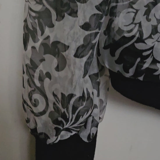Video of Front view of Sheer damask print bomber jacket with pearl and floral accents
