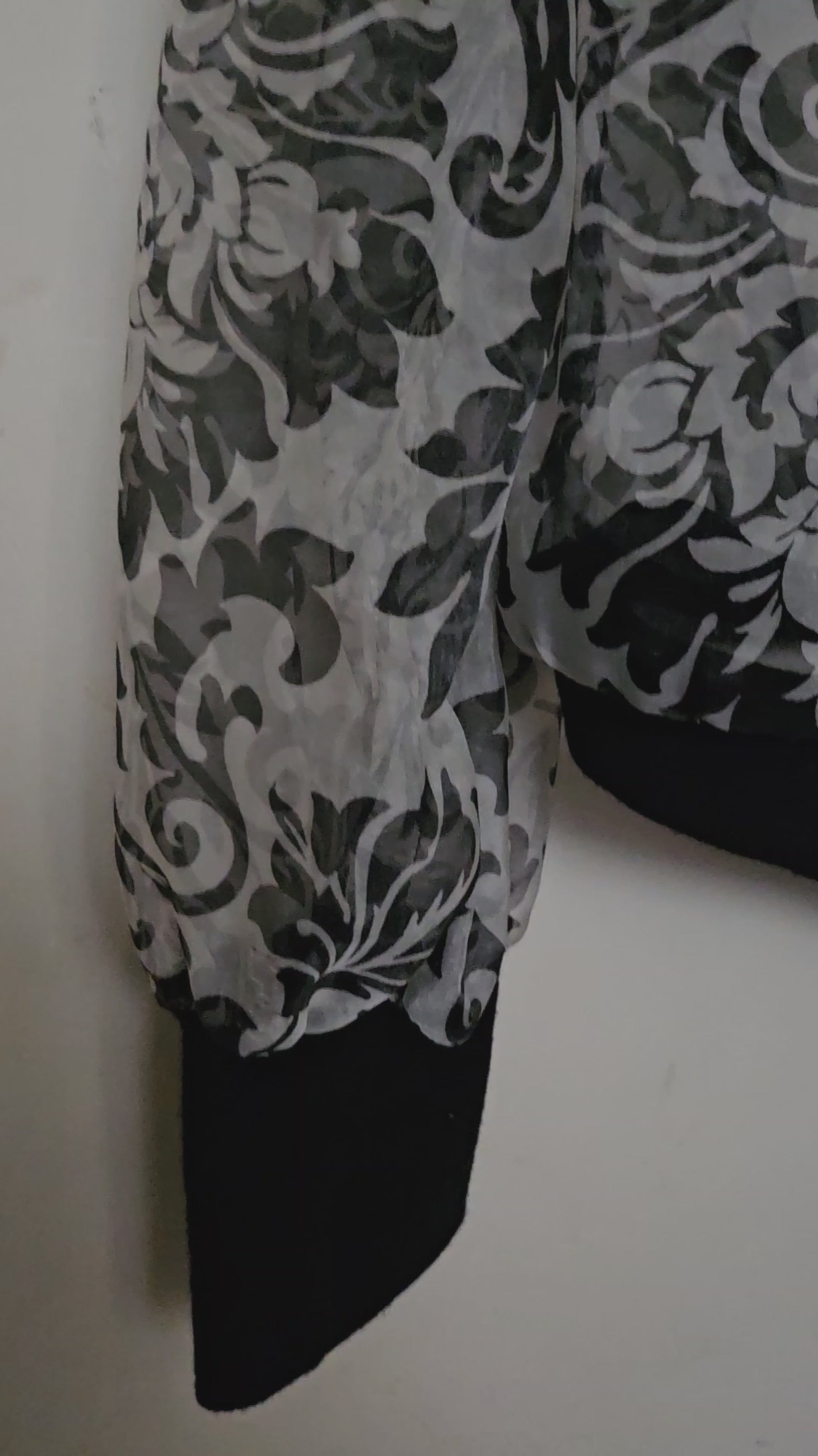 Video of Front view of Sheer damask print bomber jacket with pearl and floral accents