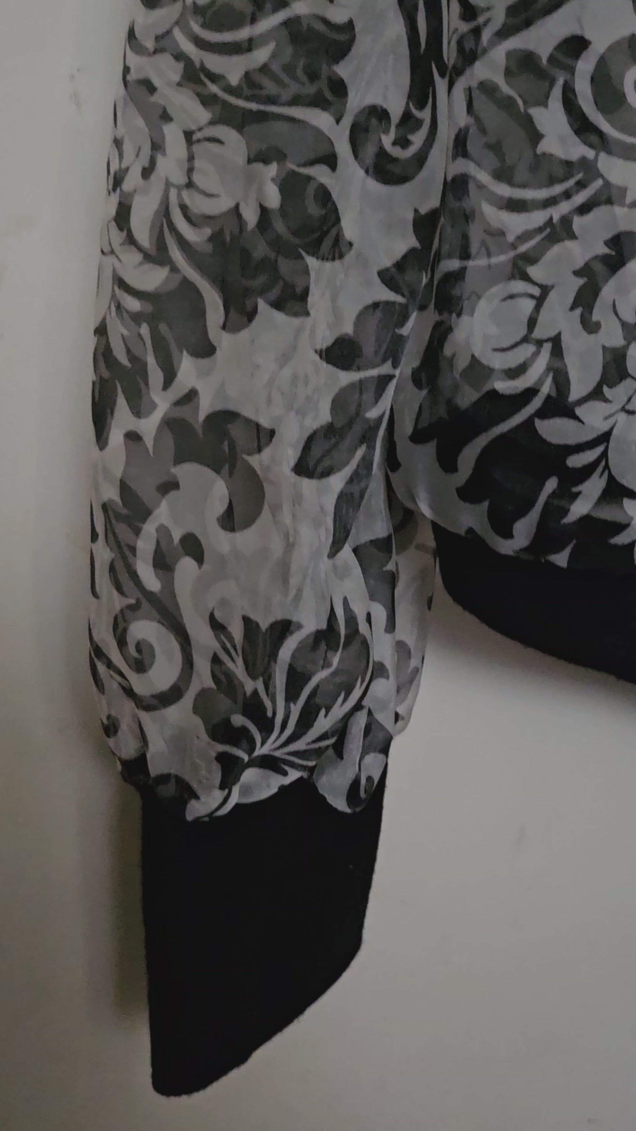 Video of Front view of Sheer damask print bomber jacket with pearl and floral accents