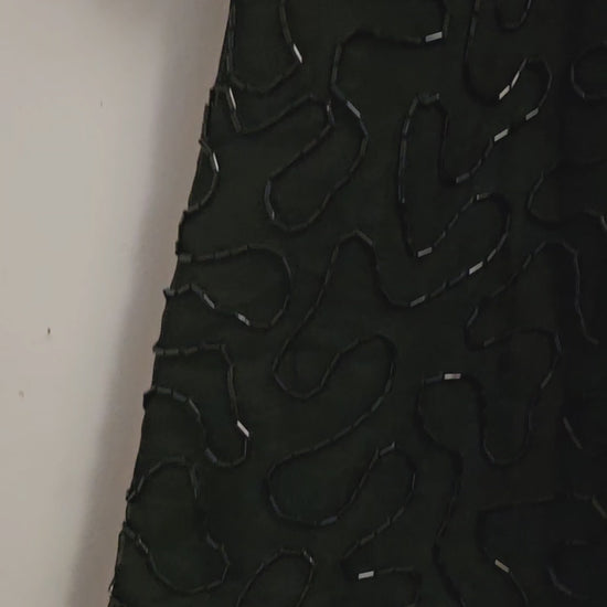 video of 80s top with flower adorned beaded top