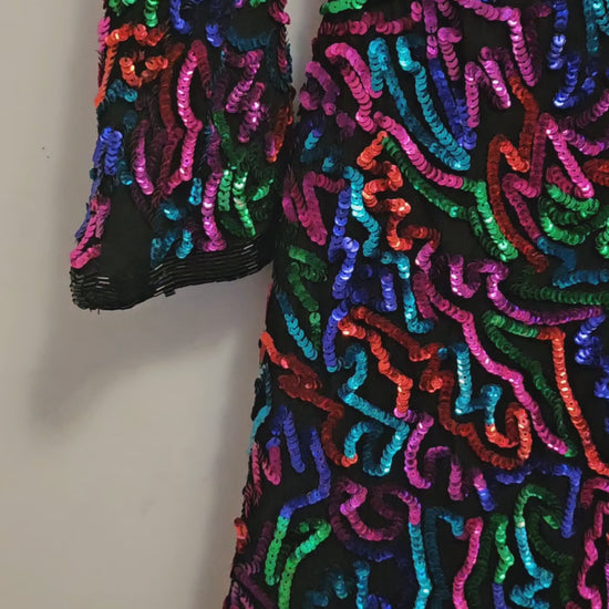 video of  Rainbow sequined jacket dress with fringe details
