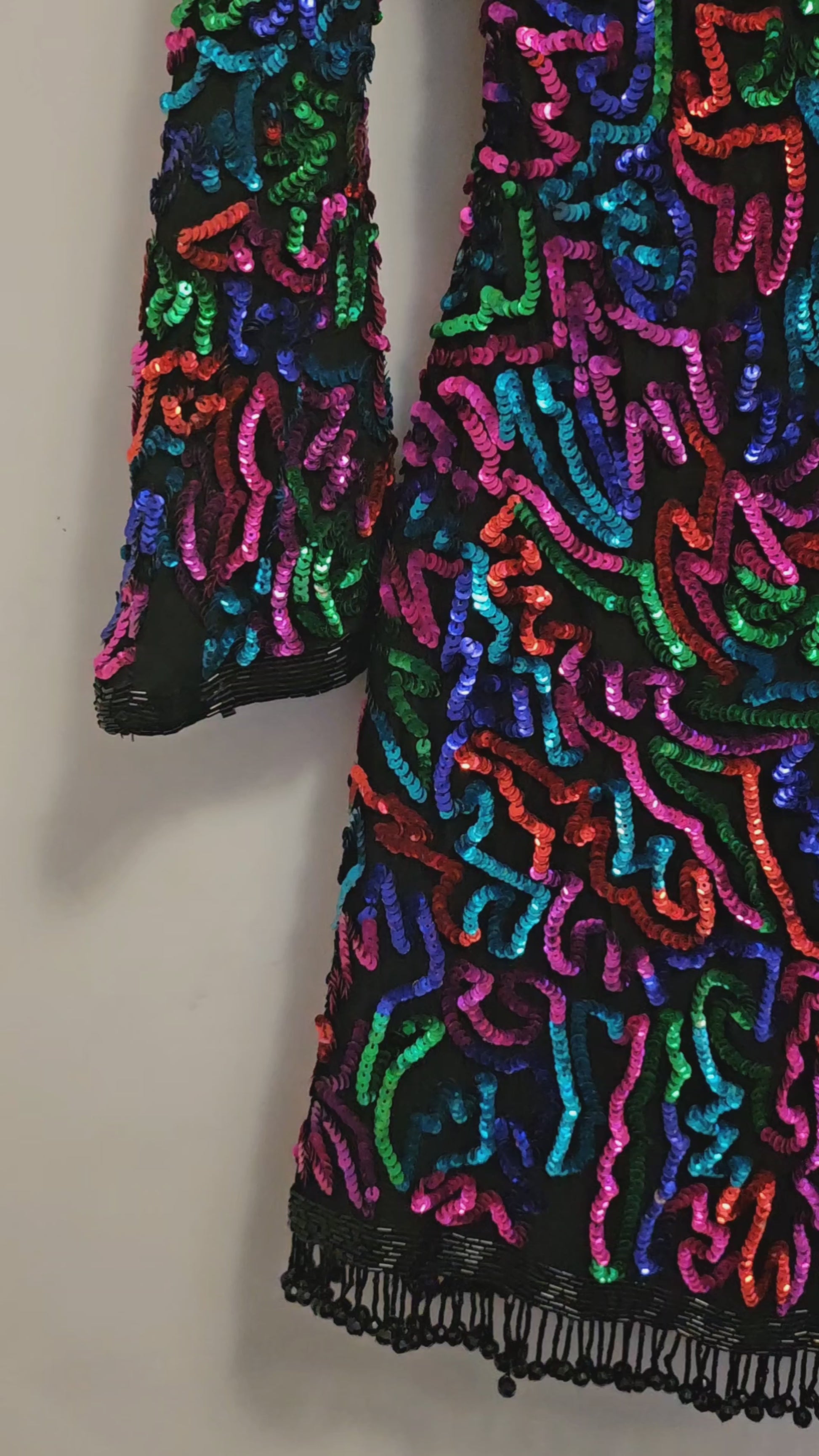 video of  Rainbow sequined jacket dress with fringe details