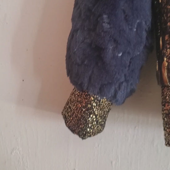 video of blue and gold bomber jacket