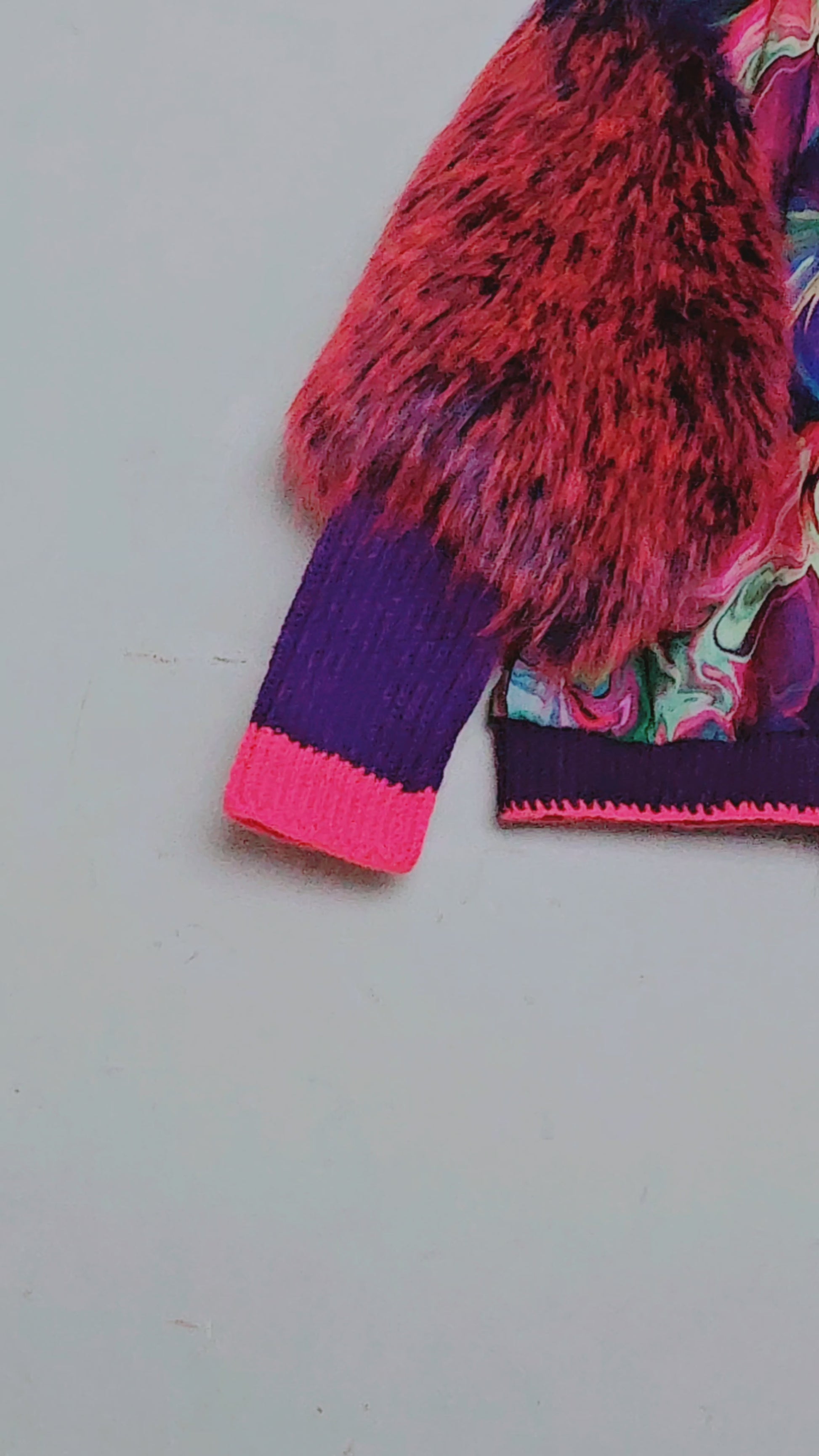 Video of Rainbow bomber jacket with faux fur puffed sleeves