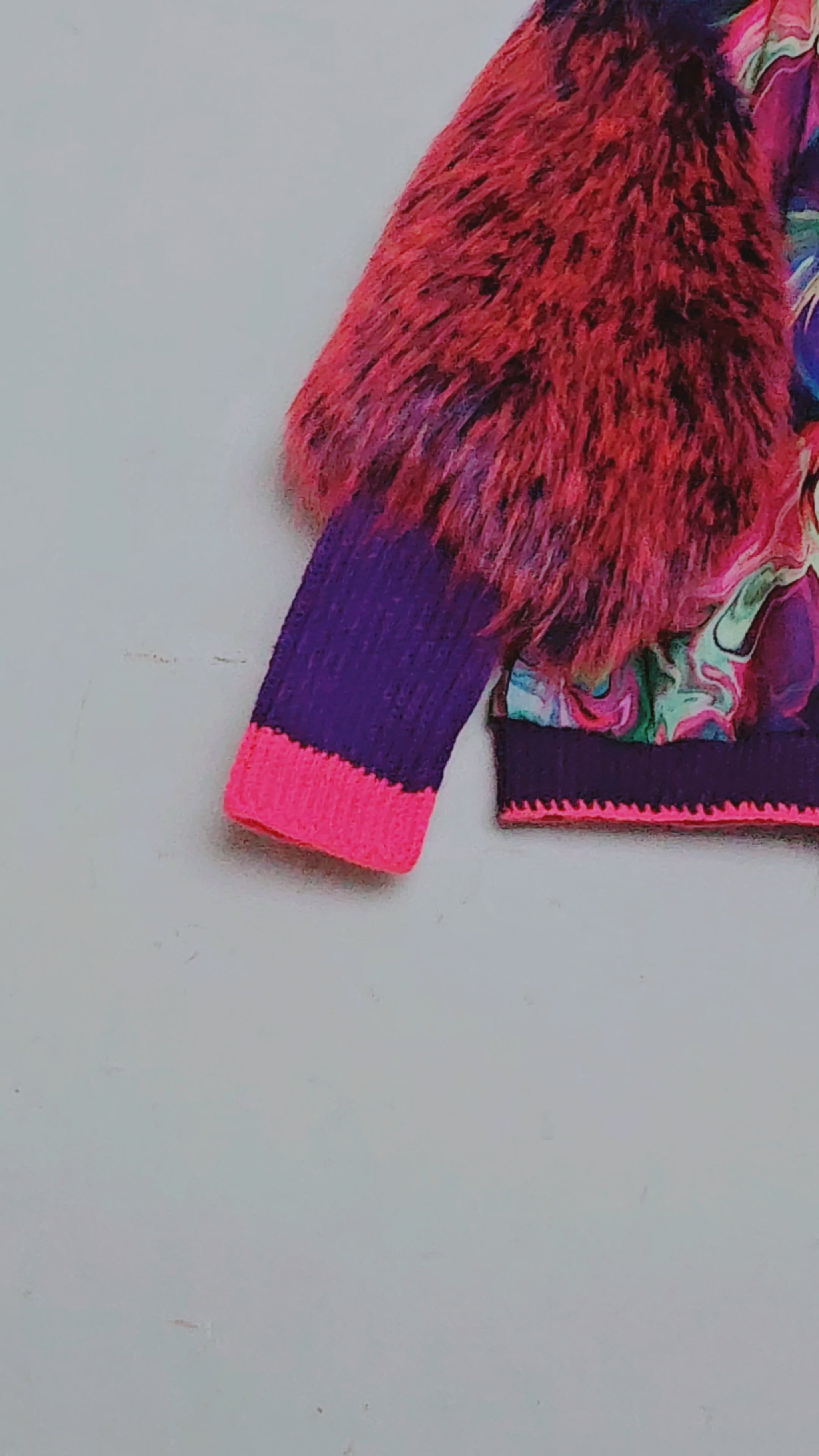 Video of Rainbow bomber jacket with faux fur puffed sleeves