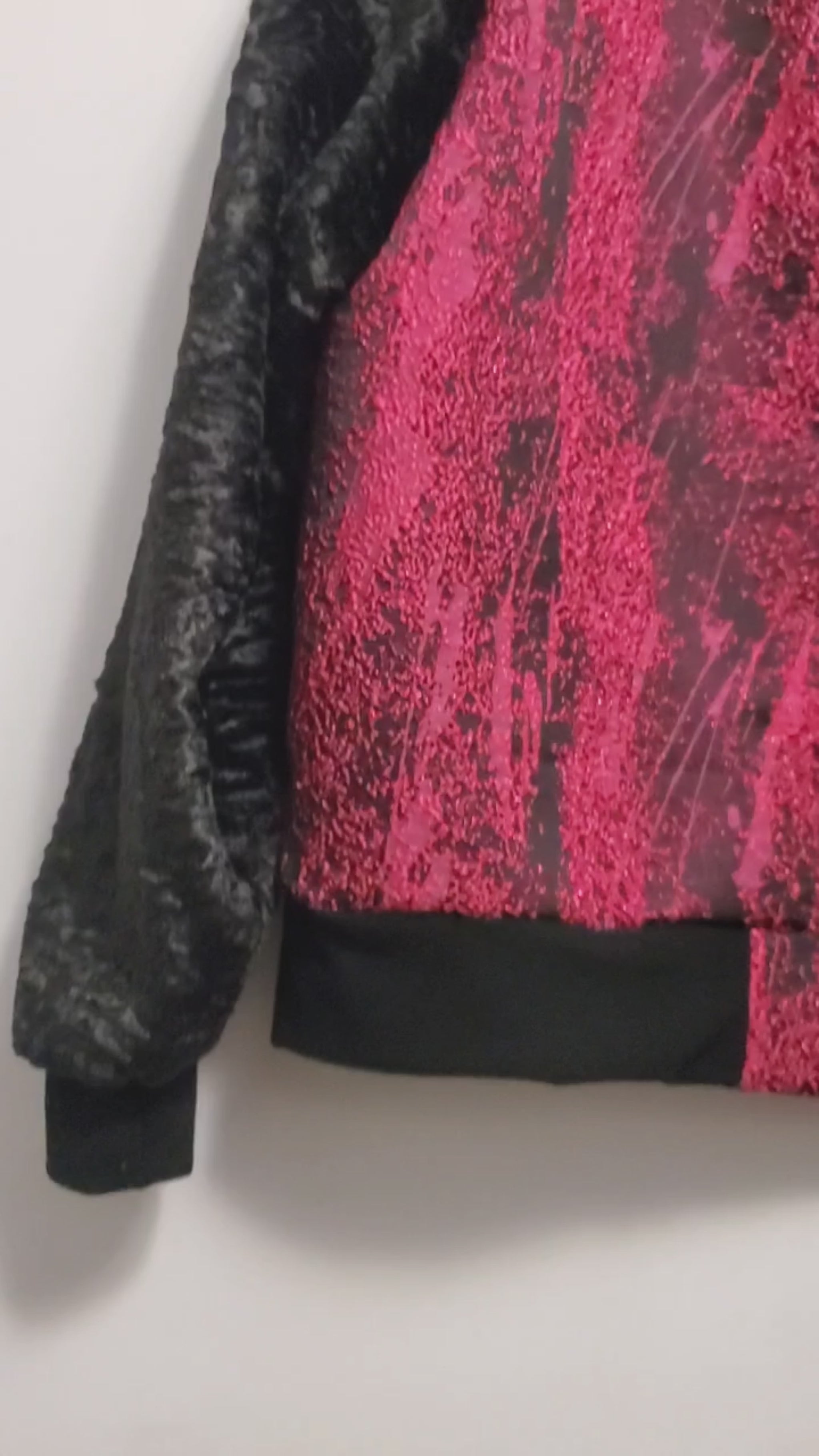 video of Fuchsia and black bomber jacket with faux fur sleeves and sequin applique details