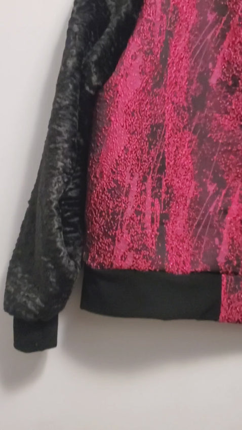 video of Fuchsia and black bomber jacket with faux fur sleeves and sequin applique details