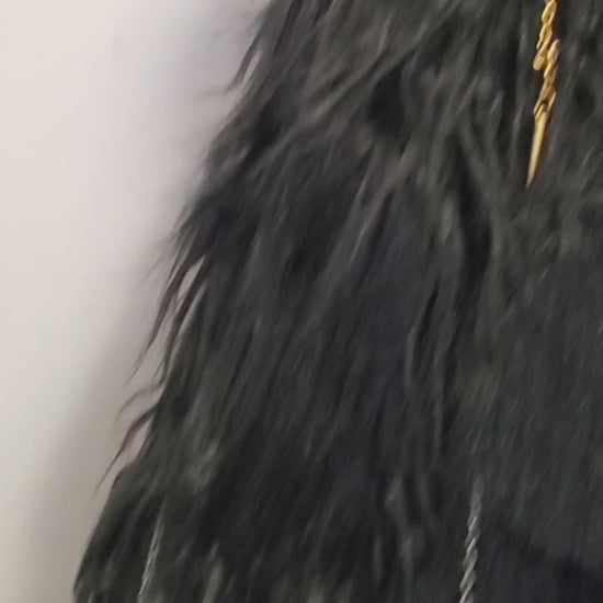 video of faux fur black coat with chain and spike details 