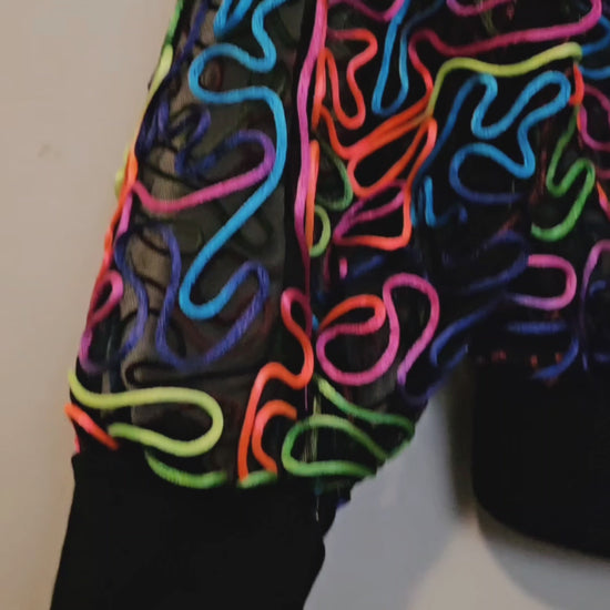 Video of rainbow embroidered mesh bomber jacket