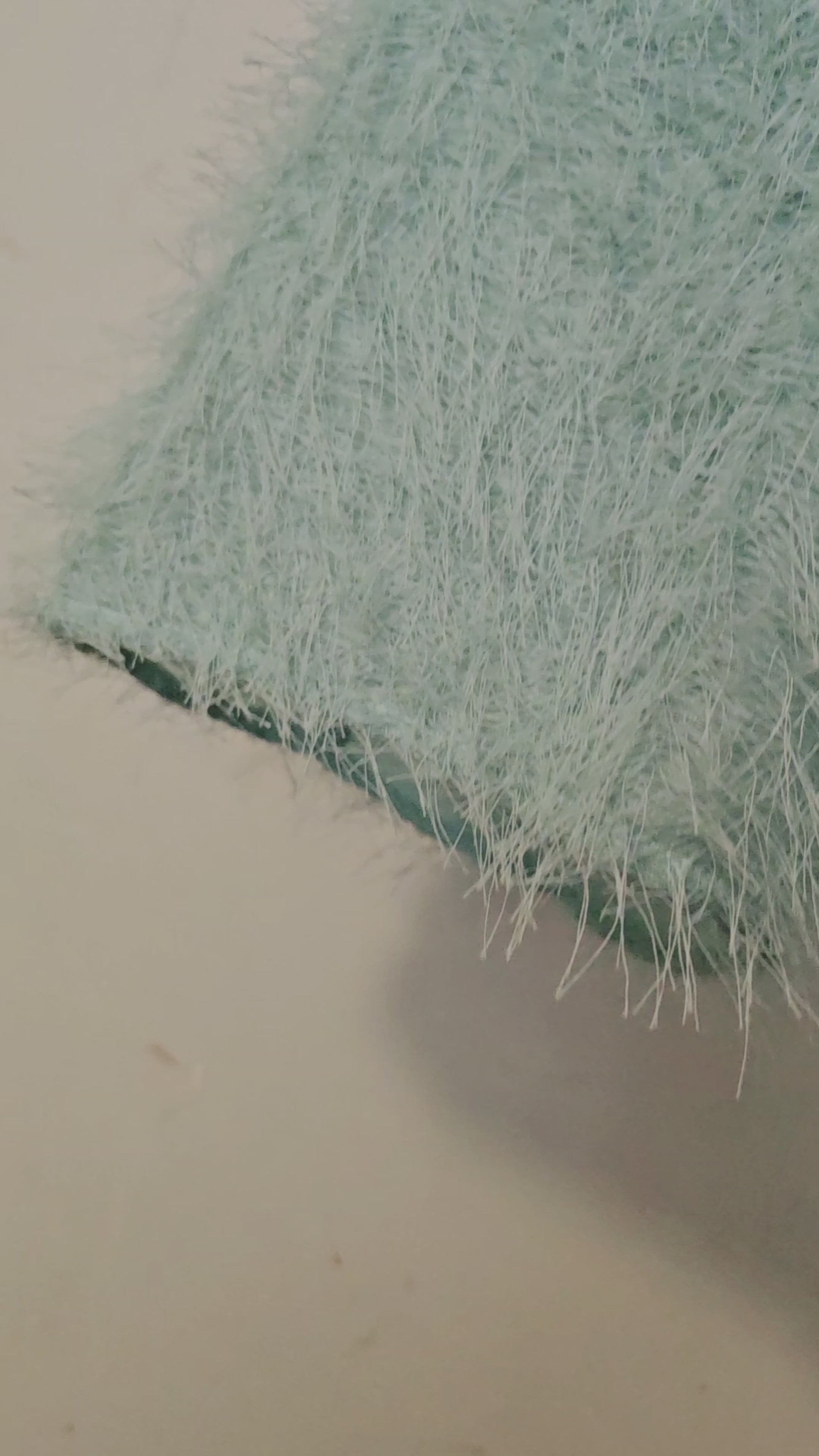 Video of Coral and mint jacket with fringe cuffed sleeves