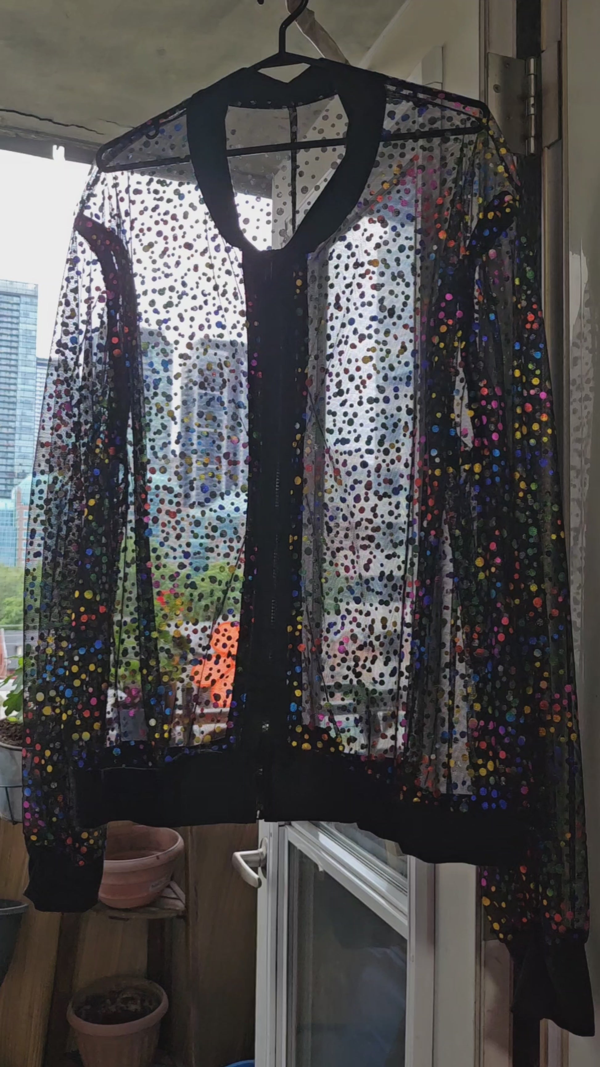 Video of Sheer metallic confetti print bomber jacket