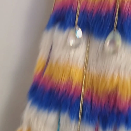 video of white rainbow striped faux fur coat with chain details