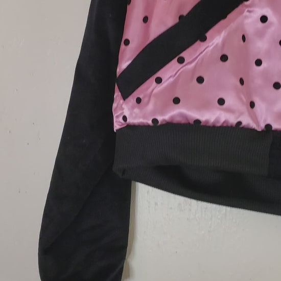 video of pink polka dot varsity jacket