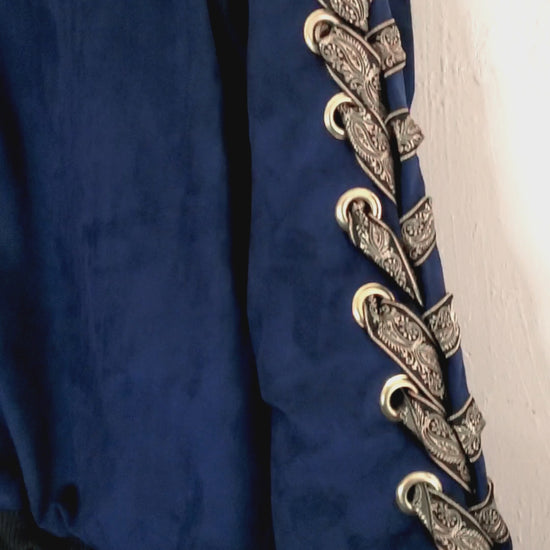 video of navy blue bomber jacket with gold lacing and eyelet front