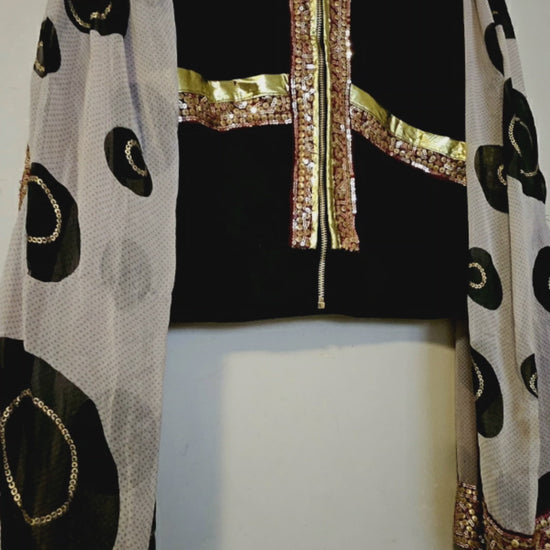 Video of Indian inspired bomber jacket with sheer cape sleeves