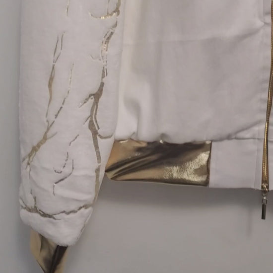 Video of White bomber with gold marble print sleeves