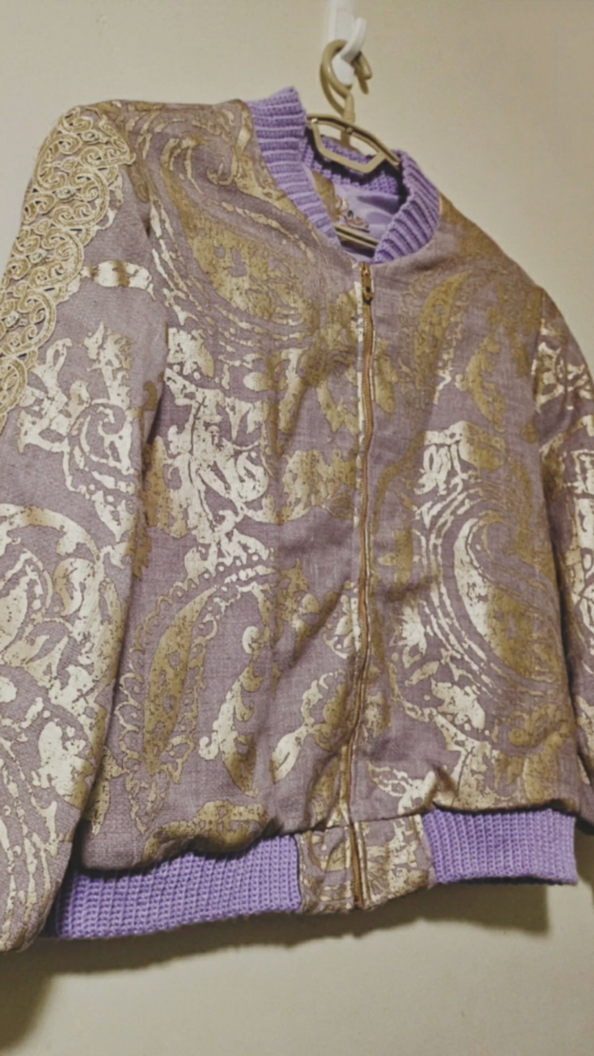 Video of the front of Lilac linen blend embossed with a golden baroque pattern